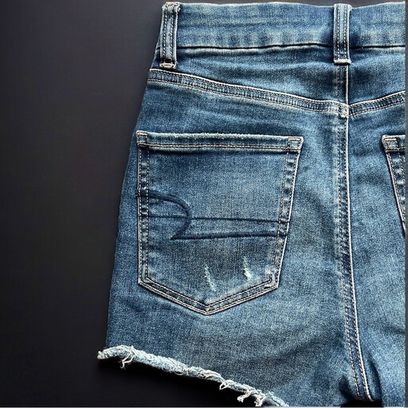 AE Next Level Stretch Curvy High Rise Shortie Distressed Denim Shorts - Picture 5 of 10